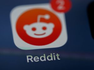 Reddit icon in a smartphone.