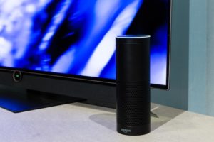 Amazon Alexa speaker in front of a TV.