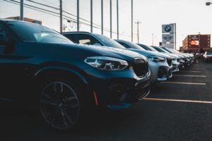 BMW SUVs lined up on a dealership lot.